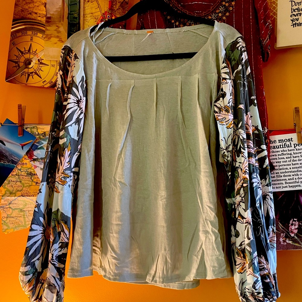 Free People top light green with floral pattern satin sleeves. NWT size large